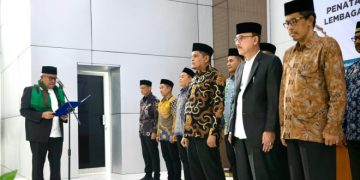 Pj Gubernur Kukuhkan Tim Pengawas Sistem Jaminan Produk Halal MPU